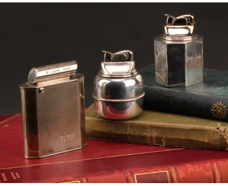 A Continental Art Deco silver table cigarette lighter, engine turned, 10cm high, marked 835, mid 20th century; others, marked