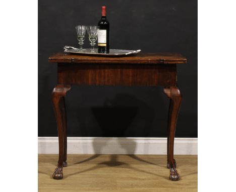 A George II mahogany games table, hinged featherbanded top inlaid for chess flanked by radiating veneers arranged as a spider