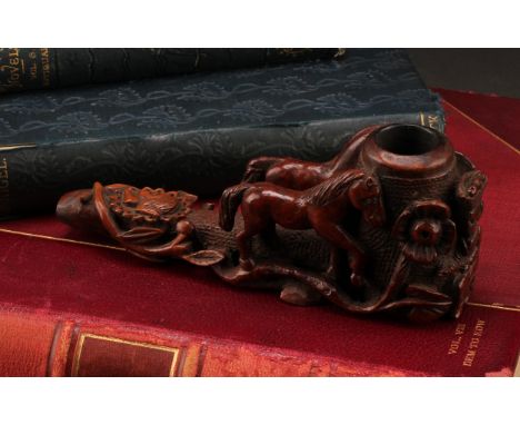 A 19th century continental carved cherrywood pipe, the bowl supported by a pair of carved horses in high relief, with female 