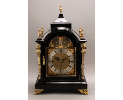 A late Victorian gilt metal mounted ebonised table clock, 18cm arched brass dial with silvered chapter ring inscribed Lambert