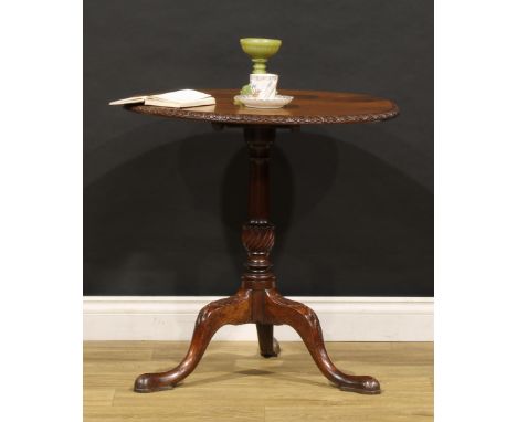 A 19th century mahogany tripod occasional table, in the George II taste, circular tilting top with acanthus border, turned co
