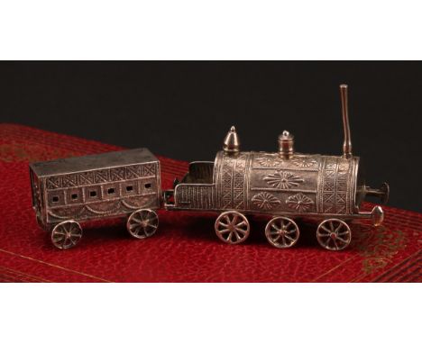 A Chinese silver toy miniature train, comprising railway locomotive and carriage, 10cm long overall, character mark, c.1900
