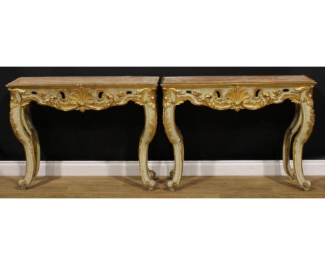 A pair of 19th century Italian painted and parcel-gilt pier tables, possibly Venetian, boldly carved with shells and leafy sc