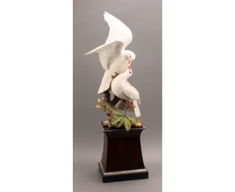 A Royal Worcester porcelain model, White Doves, modelled by R. Van Ruyckevelt, to commemorate the Silver Wedding of HM the Qu