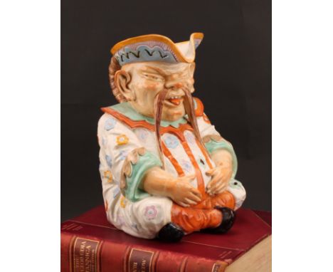 A large Continental majolica character jug, as a seated Chinaman, his plaited hair as the handle, decorated in polychrome, in
