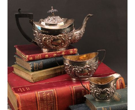 A late Victorian Rococo Revival silver three-piece tea service, comprising teapot, sugar basin and cream jug, the teapot with