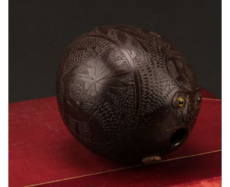 A 19th century sailor’s bugbear coconut flask, carved with a Naval anchor, flora, fauna and initials RP, 12cm long