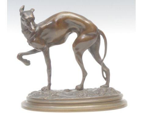 An early 20th century bronze, of a greyhound in full aspect, stepped oval base, 19cm high, 19cm long