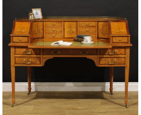 An Edwardian Sheraton Revival satinwood and marquetry Carlton House desk, shaped superstructure with brass balustrade gallery