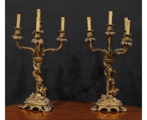 A pair of large 19th century gilt bronze four-light candelabra, acanthus campana sconces, each pillar and triform base unusua