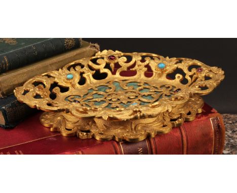 A Louis XV Revival gilt bronze navette shaped pedestal table centre dish, cast and pierced in the rococo manner, with leafy s