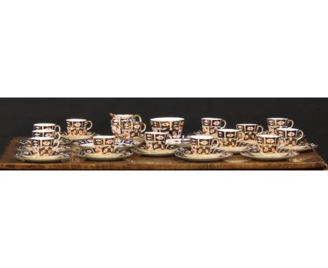 An extensive Royal Crown Derby 2451 pattern teaset inc fourteen cups, fifteen saucers, thirteen side plates, two bread/cake p