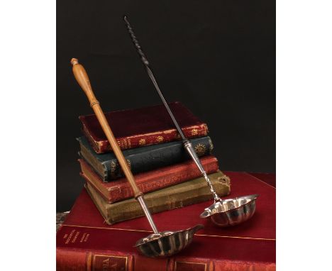 A George II silver toddy ladle, fluted oval bowl, twisted baleen handle, 39cm long, Isaac Duke, London 1746; another, turned 