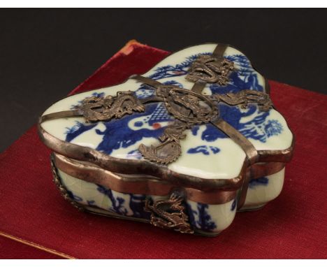 A 19th century Chinese ceramic and silver metal mounted pill box, of butterfly form, the cover painted with a father and son 