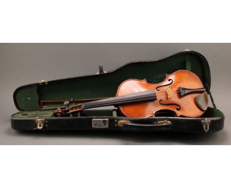 An early 20th century English violin, the two-piece back 36cm long excluding button, paper label inscribed in ink manuscript 