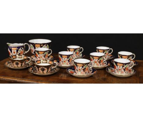 A Royal Crown Derby 6041 Imari pattern part tea service, comprising cream jug, slop basin, cups and saucers, printed marks in