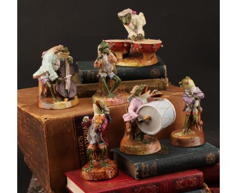 A Sitzendorf matched six-piece frog band, in animated poses, playing various instruments, decorated in polychrome enamels and