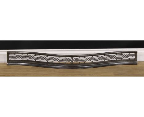 A 19th century steel serpentine fire curb or fender, the frieze pierced in the Chinese Chippendale taste, 12.5cm high, 117cm 
