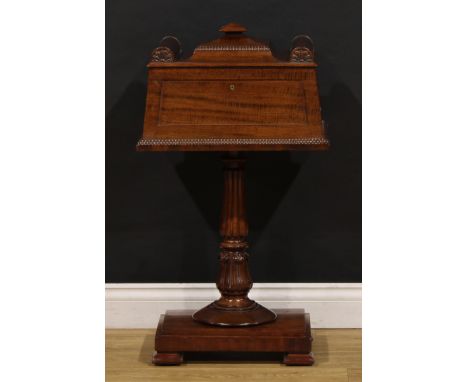 A William IV fiddleback mahogany teapoy, hinged architectural cover enclosing three compartments, lotus grasped fluted column