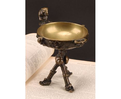 Auguste Cain (1822 - 1894), after, a bronze tazza or vide poche, cast as a tripod vessel entwined with snails, snakes and vin