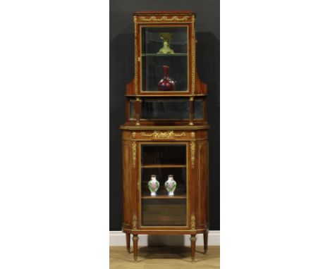 A Louis XVI Revival gilt metal mounted mahogany pier vitrine, the superstructure with a bevelled glazed door enclosing a mirr