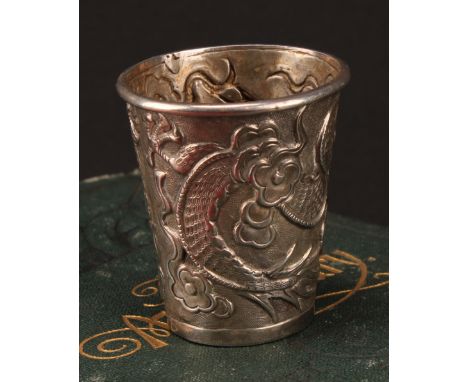 A Chinese silver tapered cylindrical beaker, chased with a dragon chasing a pearl, 4.5cm high, Wang Hing &amp; Co, Canton, c.