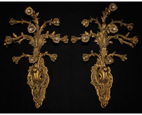 A pair of substantial Louis XV style gilt bronze eleven-light wall sconces, cast in the Rococo taste, 100cm high