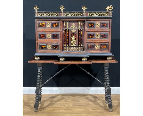 A Spanish Baroque Revival gilt metal mounted hardwood and tortoiseshell cabinet on stand, of architectural design, central do