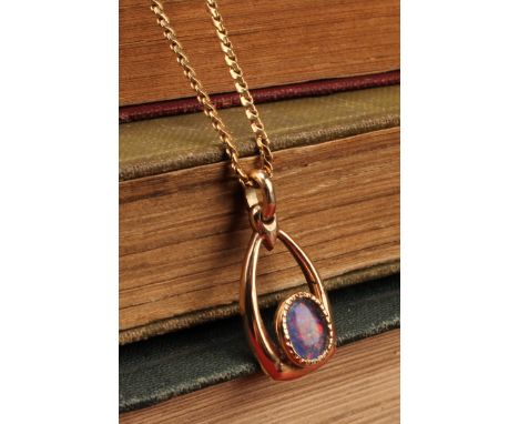 9ct gold black opal doublet pendant with 18ct gold fine chainpendant contains an oval cabochon black opal doublet that measur