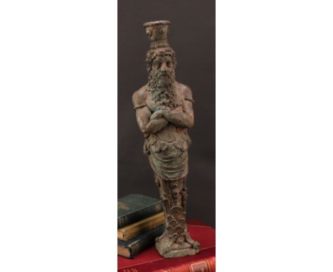 A 19th century bronze figural candlestick, cast as a herm, he stands with his arms folded, stepped square base, 51.5cm high o