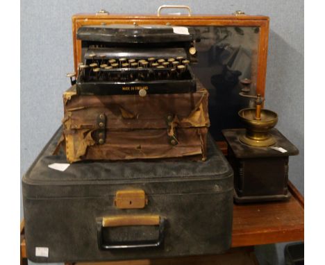 A display case, two typewriters and a coffee grinder 