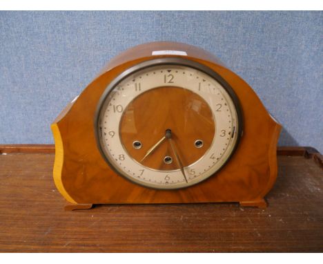 An early 20th Century walnut mantel clock 