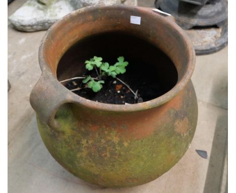 A terracotta two handled planter 