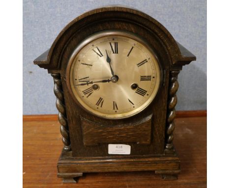 An early 20th Century oak mantel clock 