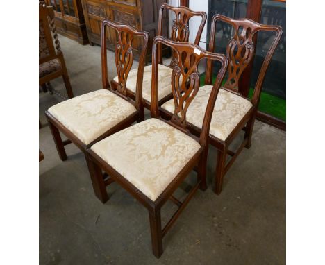 A set of four Chippendale Revival mahogany dining chairs
