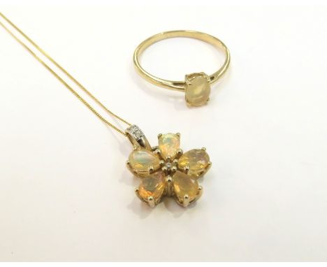 A 9ct gold Ethiopian Opal ring, size V/W, 1.7g and a 9ct gold Ethiopian Opal and white zircon floral pendant hung on 9ct gold