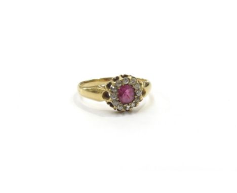 A late 19th Century 18ct gold old cut diamond and ruby cluster ring. Size O, 3g