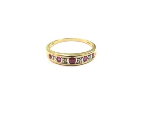 A 9ct gold ruby and diamond half hoop ring. Size S, 1.9g