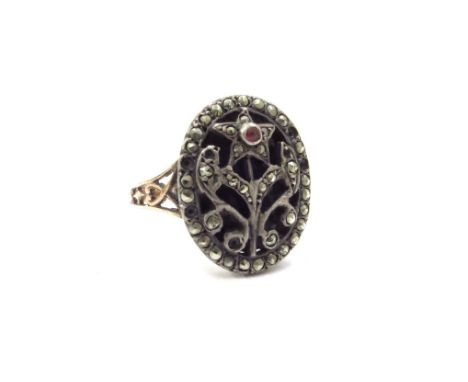 A Georgian ring, the blue enamel front applied with a marcasite set flower (7 marcasites missing), unmarked, 4.2g
