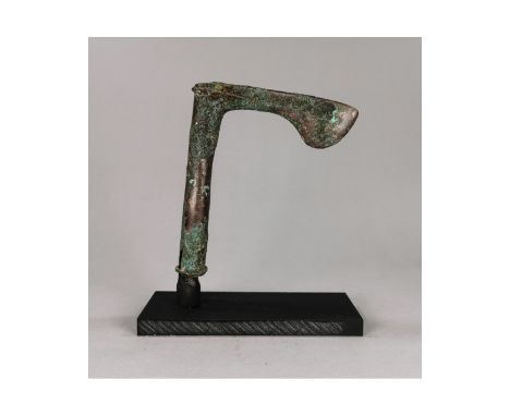 Ca. 2000 BC. Rare Luristan axe head; socket with a ribbed upper edge; ribbed chevrons to the rear face; the blade triangular 