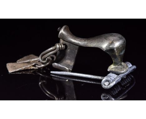 Ca.100 Ad. An interesting Roman silver knee type brooch; with attached silver axe pendants; Good condition; nice example; rar
