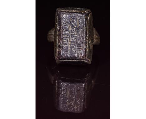 Ca.1200 AD. A nice Medieval silver ring formed by a round hoop; rectangular-shaped bezel; inserted carved intaglio with Arabi