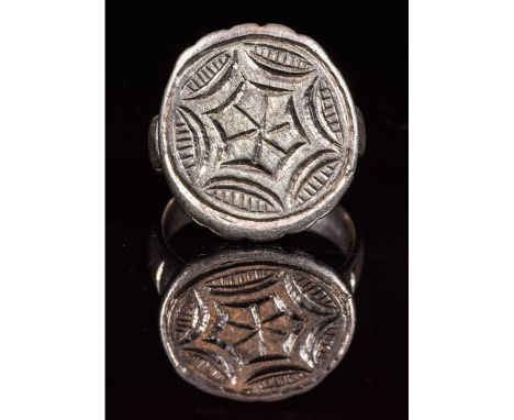 Ca.1100-1200 AD. Wearable Crusaders period Christian silver ring with a large circular bezel with punched hole decoration; ce