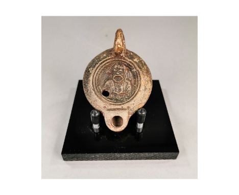 CA. 200 AD Roman Lamp with Comic Actor’s mask.Good condition, on a custom made stand; L:95mm/H:45mm;3.74/1.77in; 60gr; Proven