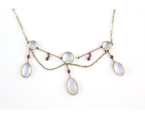 Early 20th C moonstone and ruby fringe necklace, designed as three moonstone drops, each set with a round cabochon moonstone 