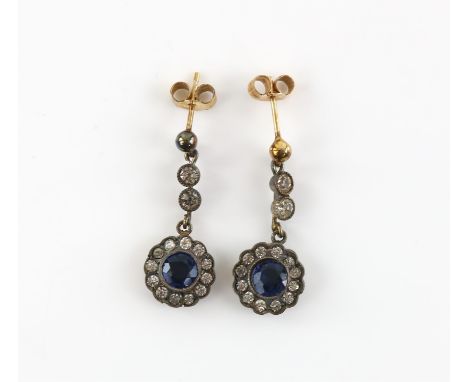 A pair of mother of pearl cufflinks, mounted in 9 ct yellow gold, with a pair of white and blue paste set drop earrings, base