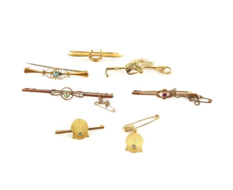 Selection of brooches and a charm, including an Edwardian peridot and pearl bar brooch, a blue topaz bar brooch, a horse bar 