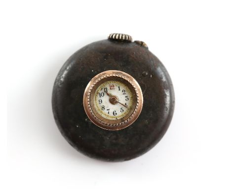 An early 20th century button hole watch, the white enamel dial set in a yellow metal bezel raised on three columns, the back 