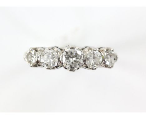 Five stone diamond ring, five graduated old cut diamonds weighing an estimated total of 1.65 carats, claw set, stamped platin