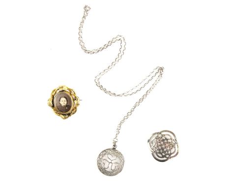 Victorian locket brooch with two photos in an ornate leaf design mount, tested 9 ct gold, along with a silver pendant and cha
